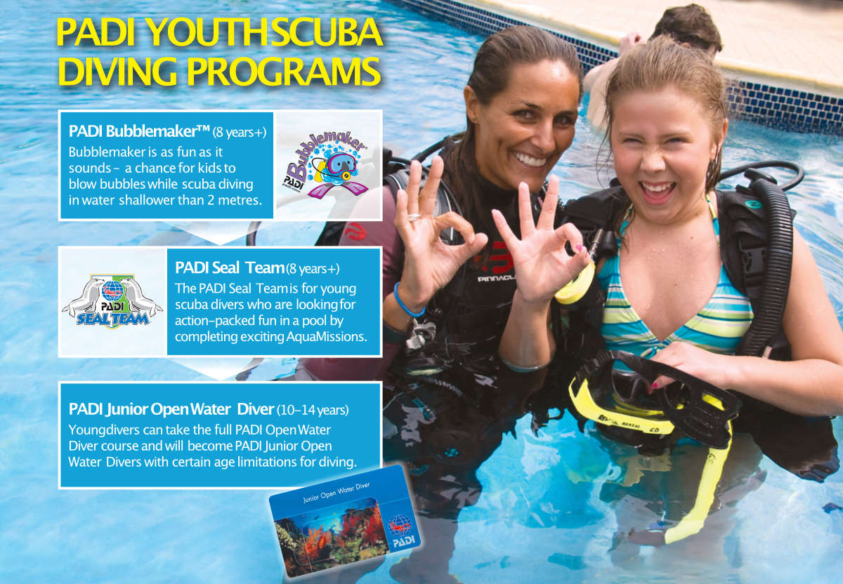 Instructor and diving kid showing the OKAY sign for divers, information on courses on the left side of the photo